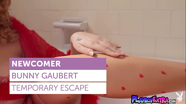 Petite redhead MILF musician Bunny Gaubert taking off her sexy lingerie